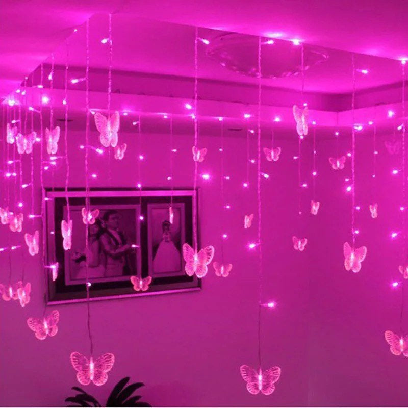 Butterfly hanging fairy lights in pink or purple